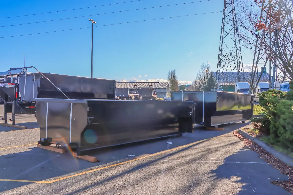 Roll-off dumpster ready for waste disposal at job site for Concrete Dumpster Rental in Allendale